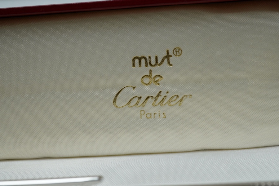 A Cartier pen, 14cm long, boxed. Condition - good